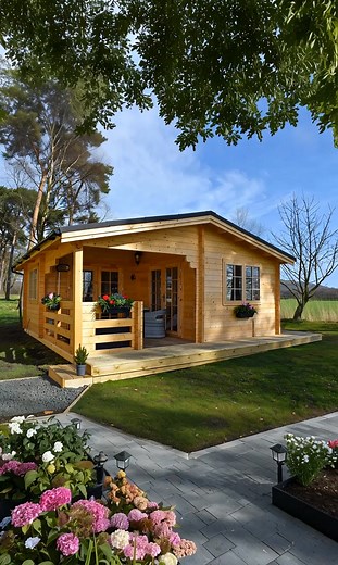 Inside This Warm and Inviting Pinewood Cabin With a Porch | Adorable Log Homes