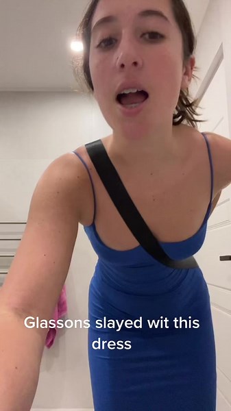 Stylish Blue Dress Showcase in Modern Bathroom