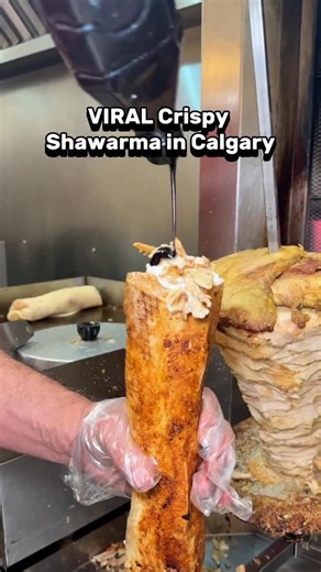 I finally tried the VIRAL crispy shawarma in Calgary, and the hype is REAL!🔥 Head to @damascafeyyc for authentic Syrian shawarma, but here’s the secret: ask for it CRISPY. Trust me, that crunch is next level. This Crispy Chicken Shawarma is a game-changer. They also make their own in-house falafels, so good! 📍 Inside Marlborough Mall (3800 Memorial Dr # 1336) And keep an eye out, they’re opening a new Sage Hill location soon! Who’s tried this already? 👀 | YYC Cravings