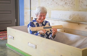 20K views · 212 reactions | Would you build your own coffin? ⚰️ Margaret River grandmother Mary Flynn keeps the biodegradable coffin she handmade and painted herself, casually on display in her home studio. The 80-year-old has never been afraid of death and she's keen to spark conversations about the taboo subject and natural burials. | ABC South West | Facebook