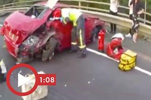 Video shows UK trucker staring at phone before crashing into woman’s car