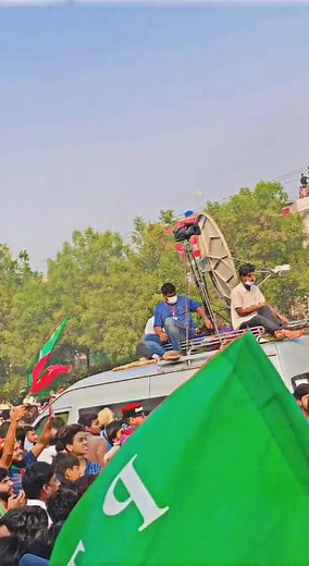 Political Rally Gathering with Flags and Cheers