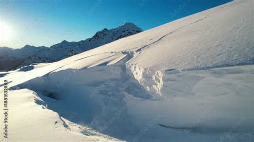 Alpine Geomorphology Capturing the natural, gravity-driven processes that slowly reshape snow-covered mountain terrain.