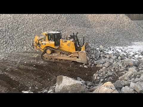 cat D8 dozer and komatsu pc360 clean up after rock crusher. Quarry action!!