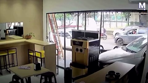 Short circuit causes car to start and crash into shop in Brazil