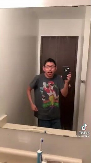 Dude with glasses dancing to”say it right” in the bathroom mirror, holding his phone tiktok viral