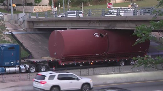 Semi truck stuck under the 11th Street bridge