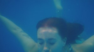 Woman swimming underwater - Free Stock Video