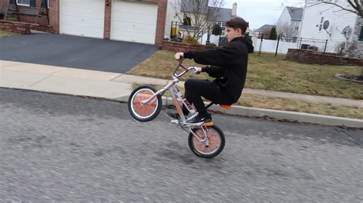 Mini bike wheelies and tricks on urban roads
