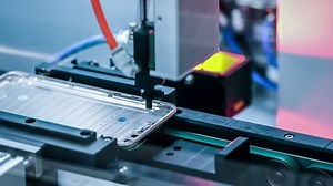 Automated machine in a smartphone assembly line - can seamless loop.