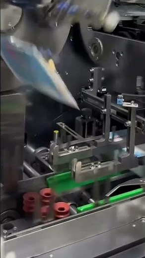 The process of making a packaging using advanced machinery in a factory by a worker