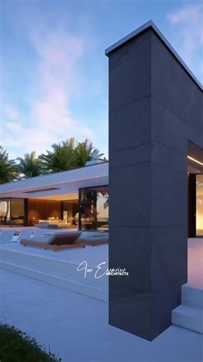 Modern Beachfront Villa with Pool and Fire Pit Lounge A single-story villa designed to dissolve the boundary between house and horizon. The entire architecture unfolds on one level, creating a fluid connection between interior spaces, the pool terrace, and the sea beyond. Wide openings frame the ocean view, while deep overhangs and pergolas shape light throughout the day. The outdoor living area becomes the heart of the house — a relaxed lounge around the fire pit, facing the water and surrounde