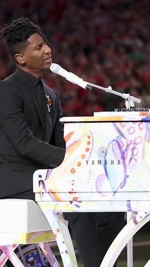 Jon Batiste's wife, Suleika Jaouad, painted the stunning butterfly design on the piano that Batiste used for his national anthem performance during the Super Bowl. The couple met at band camp when they were teens and just recently celebrated their third wedding anniversary. | CBS Mornings