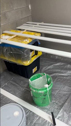 Cutting and painting trim board.