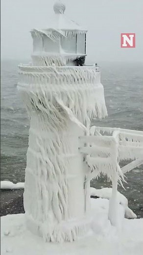 Winter Storm Covers Historic Lake Michigan Lighthouse In Ice