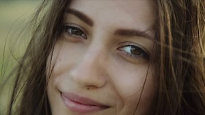 Close up of a smiling woman's face - Free Stock Video