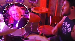 Drummer's Unexpected Cartoon Sound Effect Has Lead Singer 'Fighting For His Life' On Stage