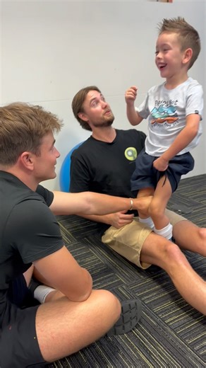 Ollie showing off improvements on his sit to stand. Parents can you see how Toby has Ollie’s feet positioned under his leg to help support. This is a lovely exercise to practice at home and is often given in our home programs. . . . . #dmi #standing #cerebralpalsy #earlyintervention #kids #smile #physicaltherapy #exercisephysiology #goldcoast | Centre of Movement