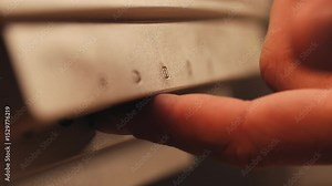 Man working and gaming on retro computer PC, IT engineer with vintage computer at home, using old fashion technology, close up of retro setup.