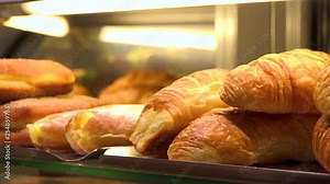 Closeup on baked goods on display on a counter in a bakery