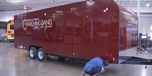 Las Vegas body shop presents new band trailer to Faith Lutheran High School