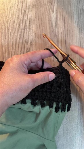 Crocheting a sleeve for my tshirt. Who would like to learn how to make this? Let me know in the comments. Follow for more & Save this video 😉🌻#crochet #crochetshirt #crochettutorials