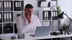 Confused Office Worker Doing Paperwork Stock Footage SBV-348895954 - Storyblocks