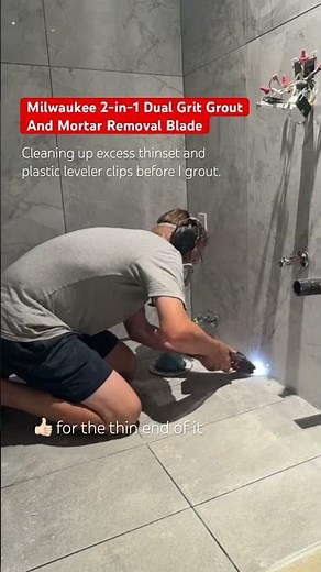 Cleaning up the mortar between my floor tiles before grouting with this Milwaukee tool.