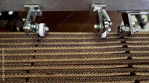 Industrial Machine Folds And Stacks Cardboard Boxes At Factory. Cardboard Box For Packing Products. Cardboard Boxes Made Of Paper An Eco-Friendly Package. Manufacturer Uses Paper. Paper Materials.