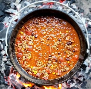 These 50 degree mornings have us craving Code 3 Spices "Sweet Heat" chili.. This recipe uses the brand's signature rubs, including the Backdraft Rub for a bit of a kick. Ingredients 1 lb. lean ground beef 3/4 lb. hot breakfast sausage 2 cups yellow onion, chopped 2 (15 oz.) cans pinto beans, not drained 1 (15 oz.) can Red Gold tomato sauce 1 (14.5 oz.) can Red Gold stewed tomatoes 2 cubes beef bouillon (or 2 tbsp. granules) 3 tsp. Code 3 Spices Backdraft Rub 1 tsp. Code 3 Spices Grunt Rub Garlic