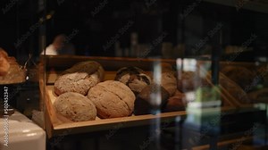 Showcase shelves with fresh pastries in the bakery. Fresh hot bread and buns.