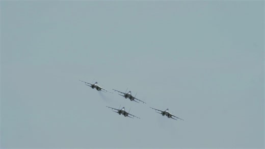 Fighter jets in formation flying through a blue sky - Free Stock Video