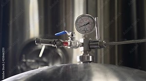 craft brewing facility. Modern complex technological industrial equipment. A plurality of pipelines, pumps, filters, gauges, sensors, motors and other parts of brewery production.. 4k
