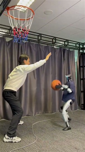 Unitree G1 humanoid robot playing basketball
