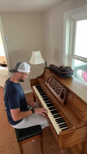 Man Struggles with Playing Piano: Summer Internship Opportunity