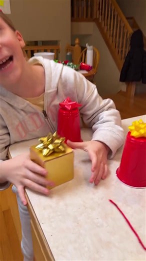 Festive Christmas Bow Family Game 🎁 Kids, dad, and whole family play christmas party game with present bows, strings, and party cups for candy and money prizes. Funny game to play with friends and family this holiday season. 🎬 This video was produced by Network Media and Benson Bros | The Scene Machine