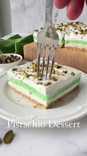 2.9K views · 20 reactions | This layered pistachio dessert is easy to make with a shortbread cookie crust, no-bake cheesecake layer, instant pistachio pudding layer, and real whipped cream on top sprinkled with chopped pistachios. (No cool whip in this recipe!) ⭐️ RECIPE ➡️ https://www.dessertnowdinnerlater.com/pistachio-dessert-recipe/ | Dessert Now, Dinner Later | Facebook