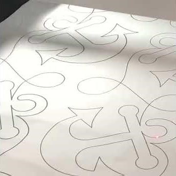 Longarm quilting pantograph with laser