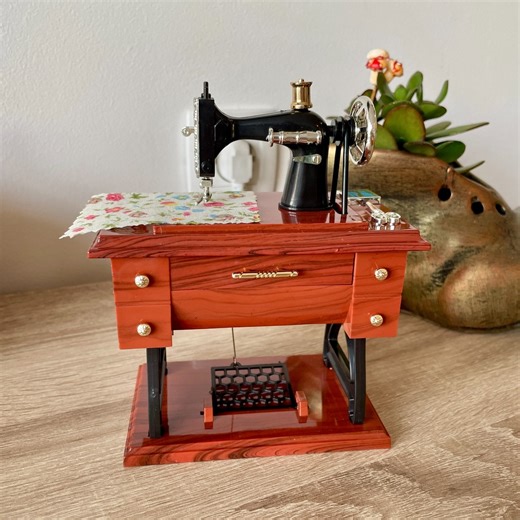 86 reactions · 11 shares | An ideal gift for friends, family, or seamstresses! "I gave it to my mother, a seamstress for many years, and she loved it. It's well-made, and as Für Elise plays, the needle, pedal, and wheel move as if someone is sewing." - Emily R. Shop now  https://minimemoco.com/products/sewing-machine-shaped-music-box | Mini Memo | Facebook