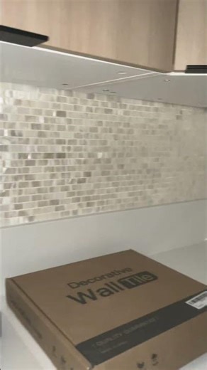 Mother of pearl shell tiles installed-before grout. #diytiling #motherofpearl #diybacksplash