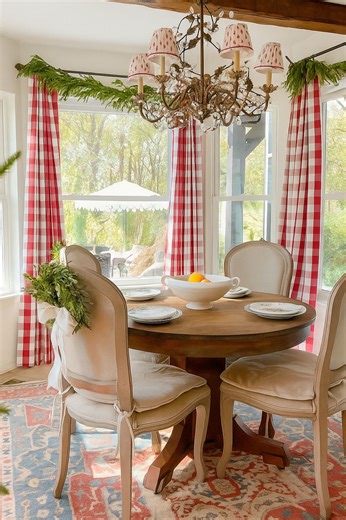 Let’s add some Holiday magic to the breakfast nook. 🎄 These red grid curtains add the perfect seasonal touch, making the whole room feel warm and festive. The coziest backdrop for creating new Christmas memories. ❤️🎄 Have you started decorating yet? Share in the comments! Featured Below: Celia, C508-17 Red grid, Pinch Pleat, 27Wx86L 🎥:@ruefer.heartandhome #twopagescurtains #twopageshome #cottagechristmas #christmasinspo #christmasdecor #cottagestyle #heartandhome #cottagehome #frenchcountryst