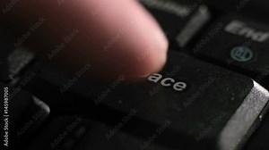 Trying to delete mistake, get moneyback, return time or cash, nostalgia concept. The index finger presses the Backspace key on black keyboard closeup loop footage.