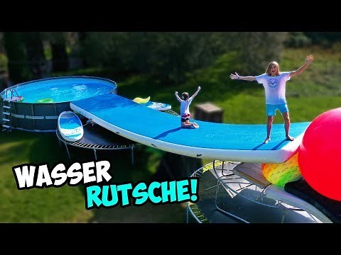 We're building a GIANT WATER SLIDE in the POOL! (made from trampoline frames!)