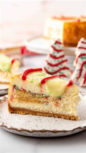 Who else is ready for Christmas? 🎅 This Little Debbie Christmas Tree Cheesecake is a delightful mashup of creamy vanilla cheesecake stuffed with our favorite holiday snack cakes and topped with white chocolate ganache, the iconic red icing stripes, and green sugar sprinkles! It’s a fun and festive treat that is sure to delight everyone this Christmas season! 🎄 Comment “recipe” and I’ll send it your way! https://houseofnasheats.com/little-debbie-christmas-tree-cheesecake/ #littledebbie #littled