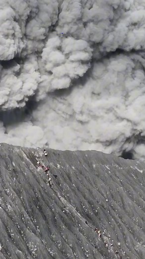 Dramatic Drone Footage of Hikers Descending Mount Dukono Amid Eruption | 9News