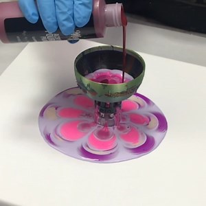 Here's a fun leaky cup acrylic pour with pinks and purples! I actually ran out of white paint so I ended up using lilac as a substitute, along with electric pink, pink tulip, pearl white, electric purple, and a bit of garnet :) | Mixed Media Girl