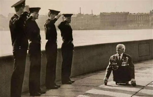 Unseen Nightmares on Instagram: "Sailors Saluting A War Veteran, Leningrad 1989. On the Neva embankment in 1989, four young sailors raise their hands in salute to a decorated veteran seated close to the pavement. His name is Anatoly Leopoldovich Golimbievsky, a World War II marine who had lost both legs during the war. The moment was photographed by Ivan Kurtov while covering a Victory Day gathering of veterans in Leningrad. Kurtov had met Golimbievsky at that event and built a small photo story