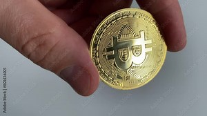 bitcoin close up. show coin. Slow motion video. Vertical video. High quality video in 4K format.