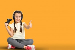 Free Photo | Child using video game controller. Isolated on yellow background.