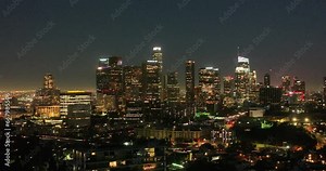 Illuminated streets downtown Los Angeles skyline at twilight dusk night. Aerial view. Los Angeles at Dusk. Aerial view of Los Angeles downtown city night skyline. LA valley California cityscape night